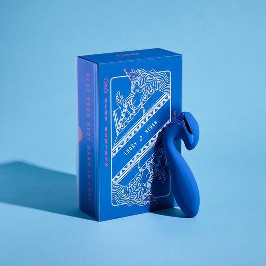Blue silicone vibrator with packaging on a blue background