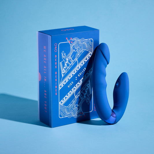 Blue vibrator with packaging on a blue background