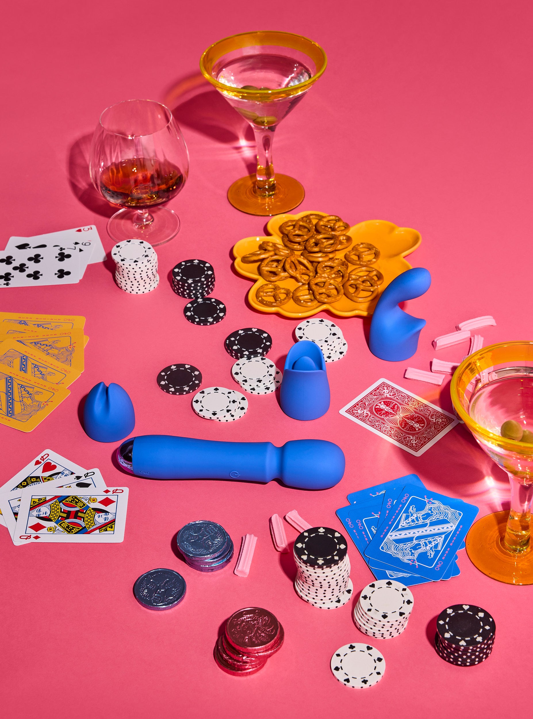 Poker-themed items including cards, chips, and dice on a pink background